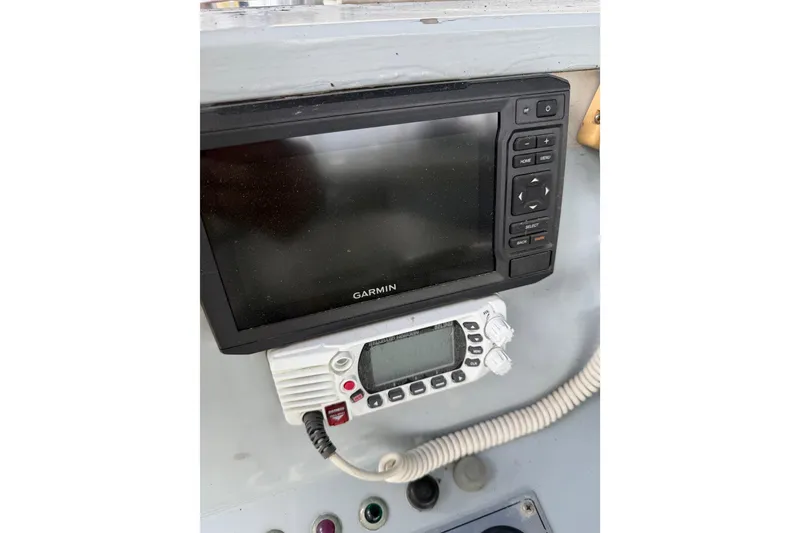 Slide: The Image of Garmin marine electronics on 1979 Willard Marine 50 Utility Launch dashboard. - 18