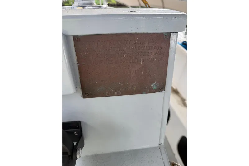 Slide: The Image of 1979 Willard Marine 50 Utility Launch identification plaque on a boat interior. - 19