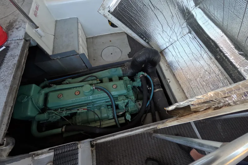 Slide: The Image of Engine compartment of a 1979 Willard Marine 50 Utility Launch, featuring a Detroit Diesel engine. - 22