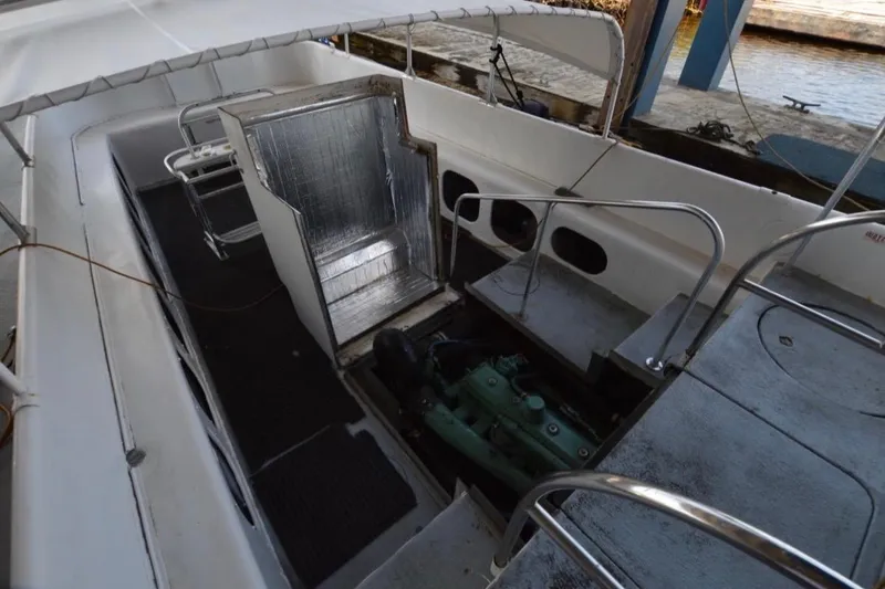 Slide: The Image of 1979 Willard Marine 50 Utility Launch interior with engine compartment and seating area. - 24