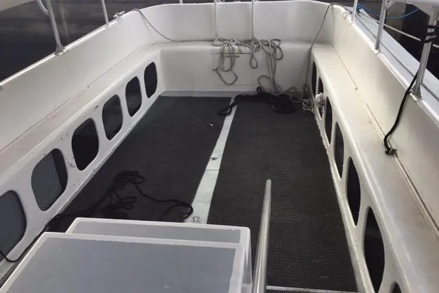 Slide: The Image of 1979 Willard Marine 50 Utility Launch interior with seating and ropes. - 5