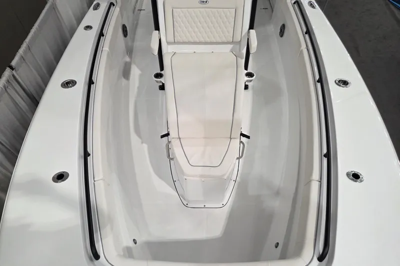 Slide: The Image of 2026 Sea Hunt Ultra 275 Coffin Box boat interior, featuring sleek white seating and modern design. - 11