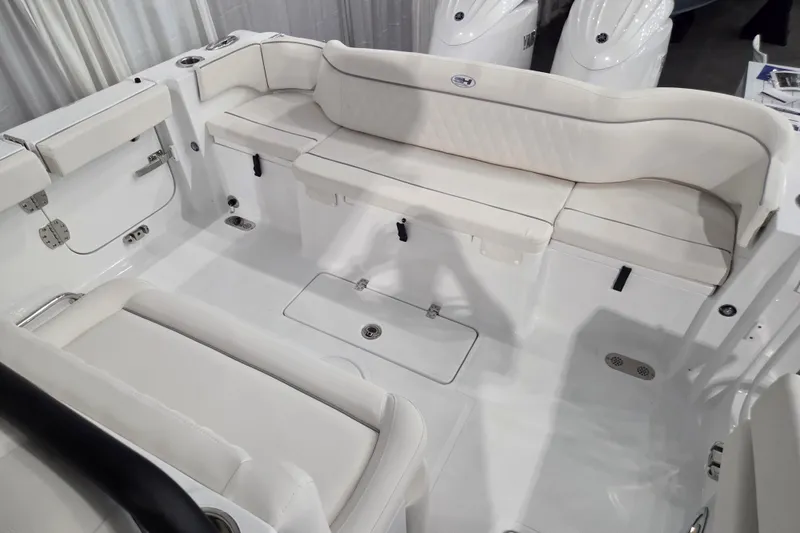 Slide: The Image of 2026 Sea Hunt Ultra 275 Coffin Box boat interior with white cushioned seating. - 4
