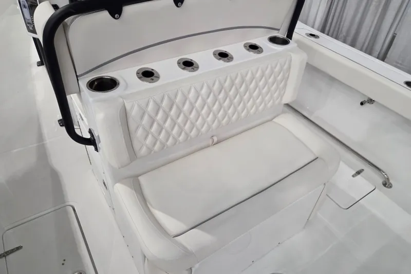 Slide: The Image of 2026 Sea Hunt Ultra 275 Coffin Box boat seating with cup holders and quilted upholstery. - 5