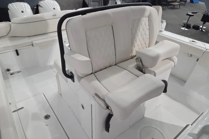 Slide: The Image of 2026 Sea Hunt Ultra 275 Coffin Box boat interior with plush seating and modern design. - 8