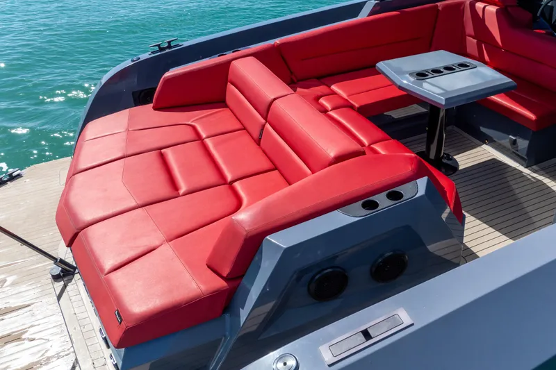 Slide: The Image of Luxurious red seating on 2021 Vanquish Yachts 45, with ocean backdrop. - 12