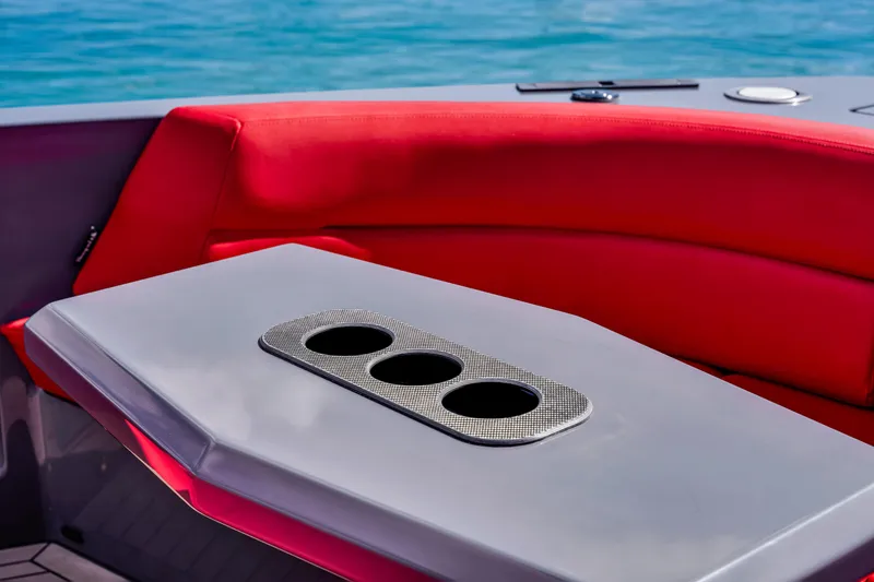 Slide: The Image of Red seating and table with cup holders on 2021 Vanquish Yachts 45. - 18