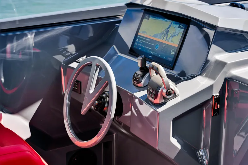 Slide: The Image of Helm of 2021 Vanquish Yachts 45 with modern controls and navigation display. - 27