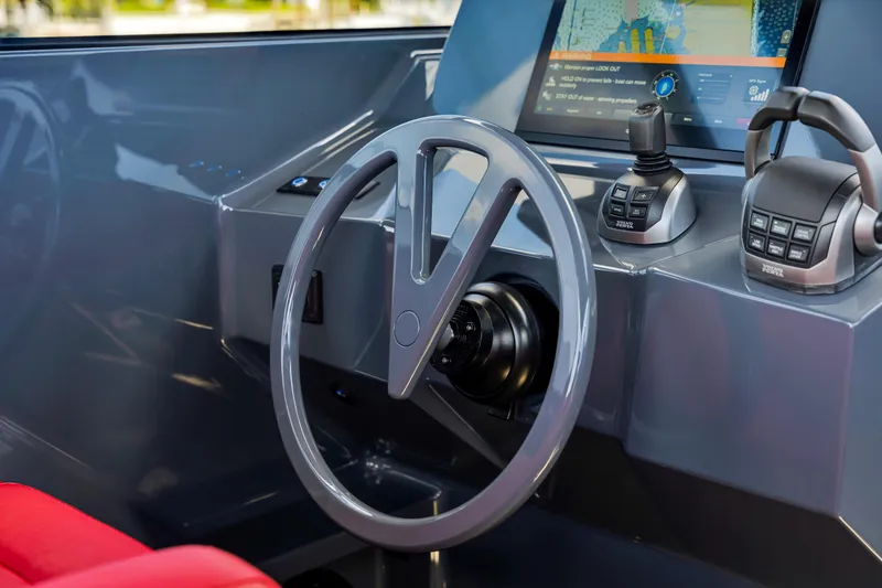 Slide: The Image of Steering wheel and controls of 2021 Vanquish Yachts 45, featuring modern navigation technology. - 29