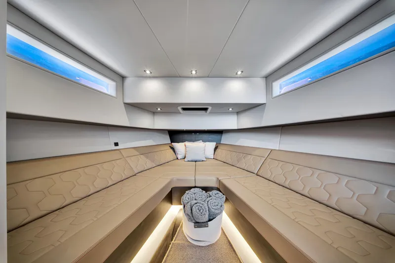 Slide: The Image of Luxurious interior of 2021 Vanquish Yachts 45 with beige seating and modern lighting. - 33