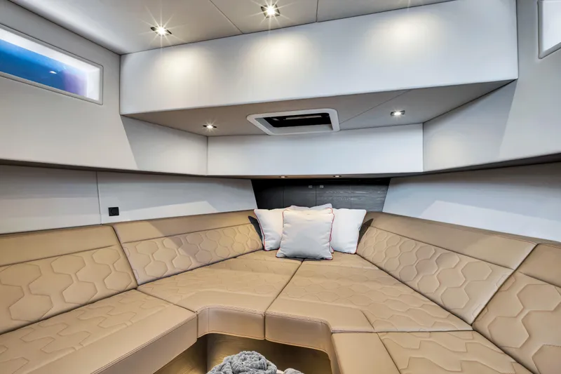 Slide: The Image of Luxurious interior of 2021 Vanquish Yachts 45 with beige seating and modern lighting. - 34
