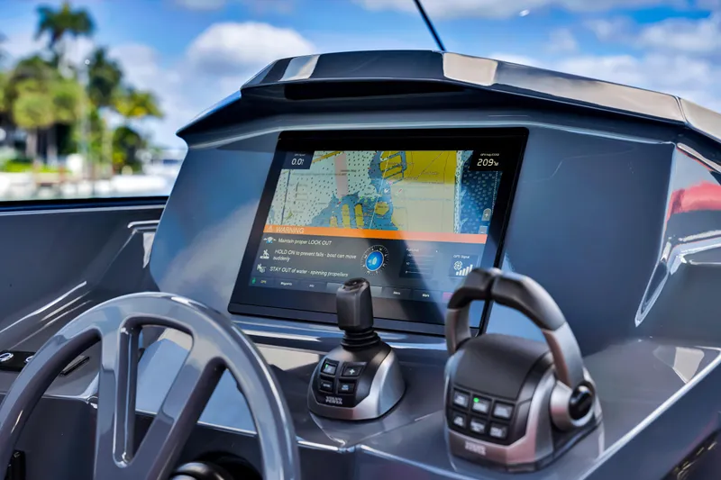 Slide: The Image of Dashboard of 2021 Vanquish Yachts 45 with navigation display and controls. - 4