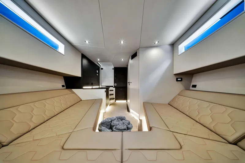 Slide: The Image of Luxurious interior of 2021 Vanquish Yachts 45 with modern seating and ambient lighting. - 40