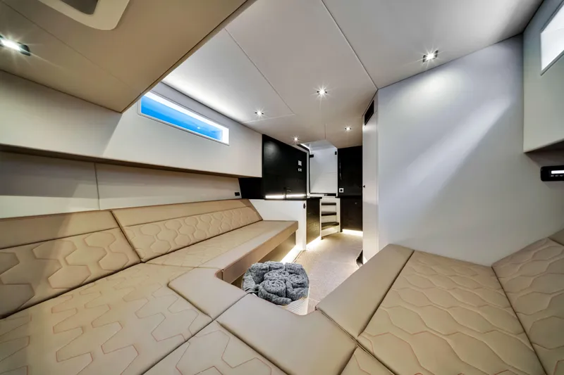 Slide: The Image of Luxurious interior of 2021 Vanquish Yachts 45, featuring modern seating and ambient lighting. - 41