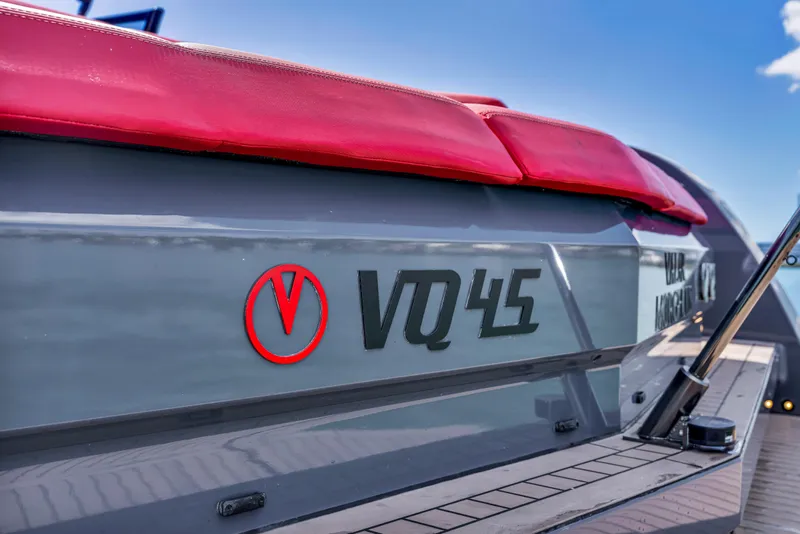 Slide: The Image of Vanquish Yachts 2021 VQ45 with red seating, sleek design, and modern detailing. - 46