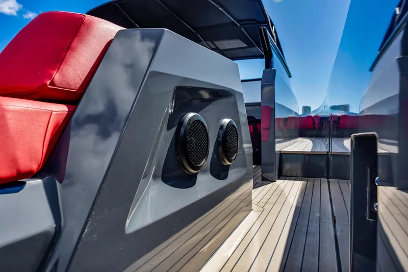 Slide: The Image of 2021 Vanquish Yachts 45 with sleek design, red seating, and modern deck features. - 48