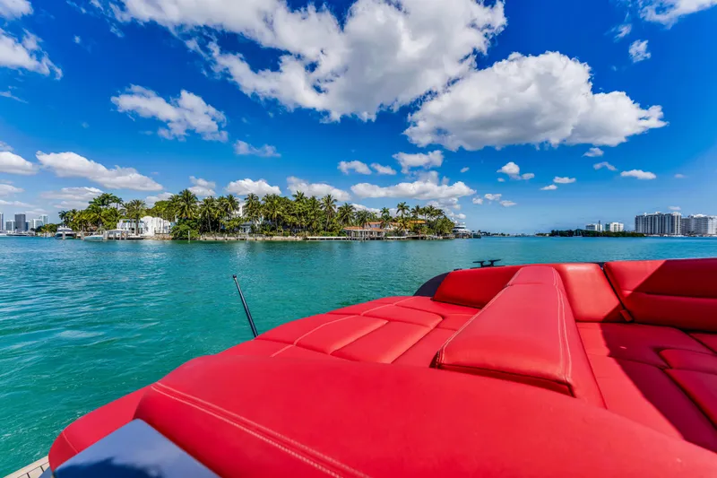 Slide: The Image of Luxurious Vanquish Yachts 45, 2021 model, cruising in tropical waters under a vibrant sky. - 50