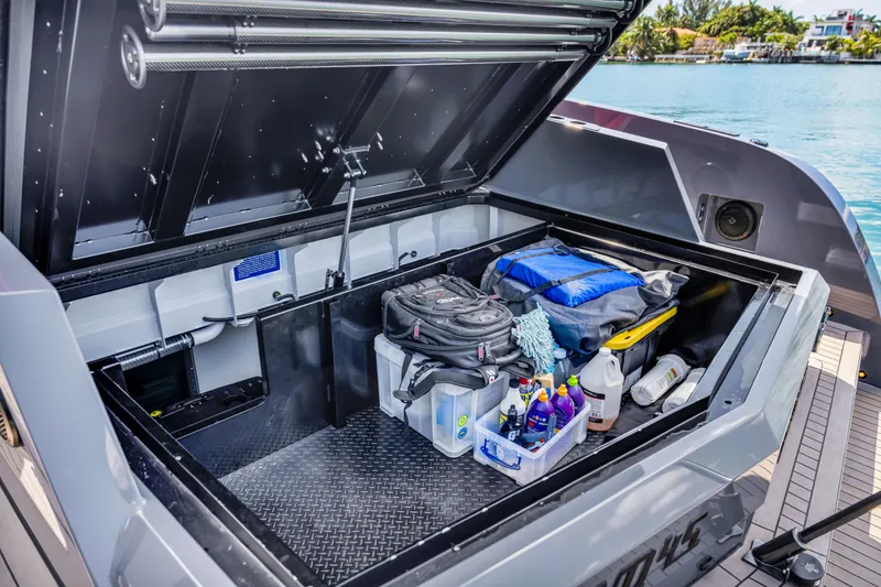 Slide: The Image of Storage compartment of 2021 Vanquish Yachts 45, featuring organized gear and supplies. - 53