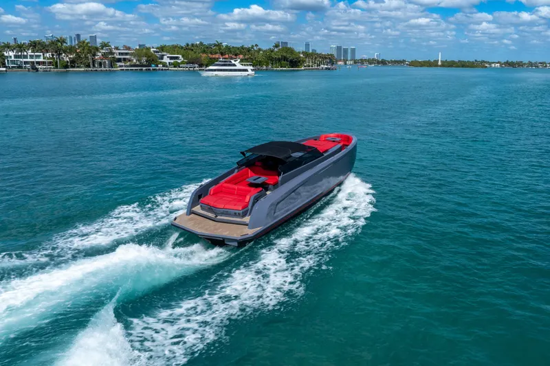 Slide: The Image of Vanquish Yachts 45, 2021 model, cruising on clear blue waters under a sunny sky. - 6