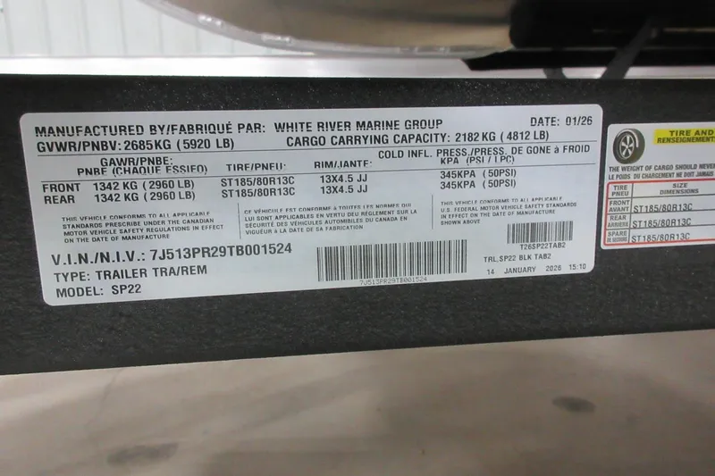 Slide: The Image of Label on Sun Tracker SportFish 22 DLX trailer, showing specifications and safety standards. - 8