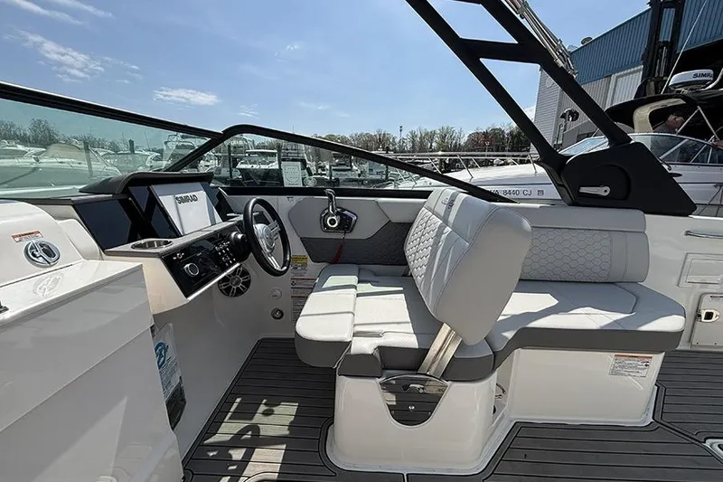 Slide: The Image of 2024 Sea Ray SDX 250 Outboard interior with modern helm and comfortable seating. - 13