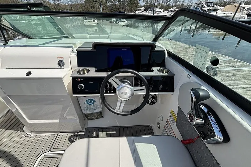 Slide: The Image of 2024 Sea Ray SDX 250 Outboard helm with modern controls and sleek design. - 14