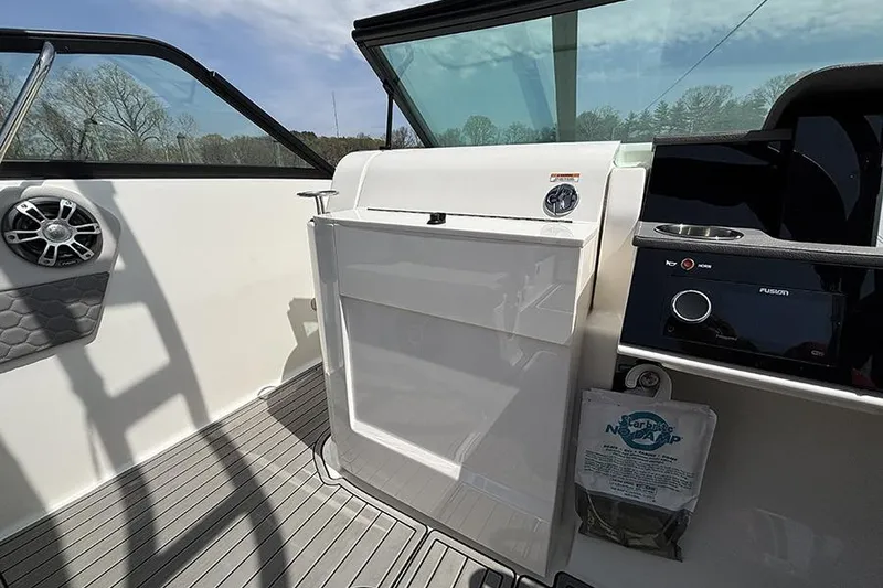 Slide: The Image of 2024 Sea Ray SDX 250 Outboard interior with sleek dashboard and modern controls. - 16