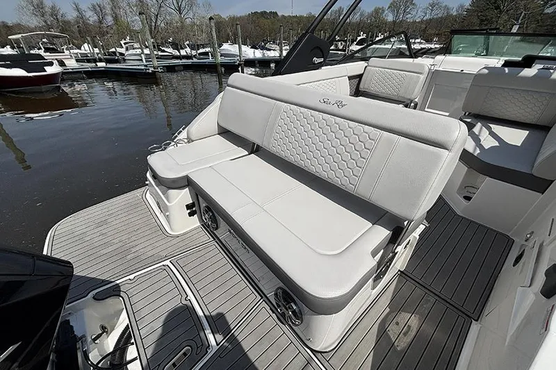 Slide: The Image of 2024 Sea Ray SDX 250 Outboard boat with luxurious seating at a marina. - 3