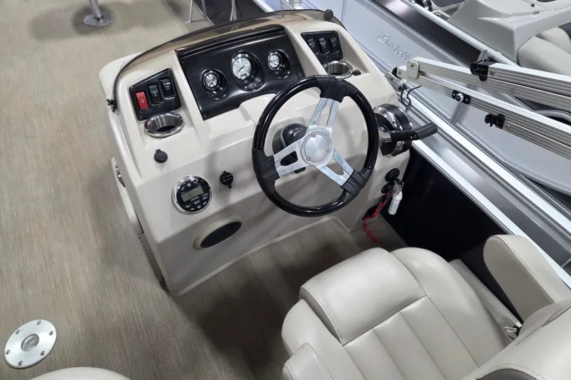Slide: The Image of 2018 Bennington 22SFX boat dashboard with steering wheel and control panel. - 10