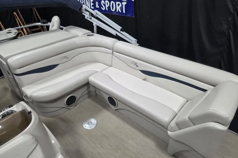 Slide: The Image of 2018 Bennington 22SFX boat interior with beige seating and modern design. - 9