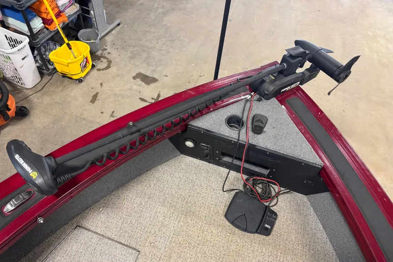 Slide: The Image of 2022 Tracker Targa V-18 WT boat with Minn Kota trolling motor in garage setting. - 10