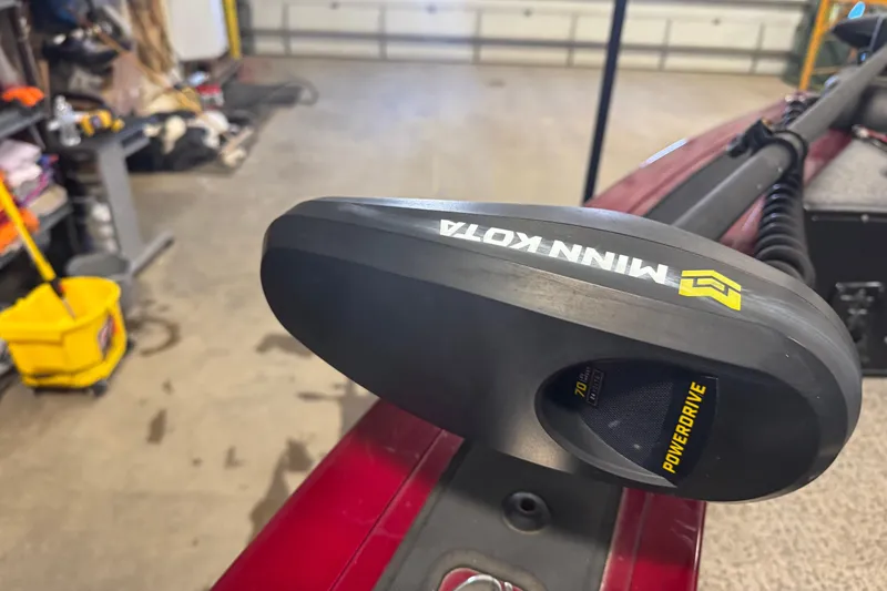 Slide: The Image of Minn Kota PowerDrive motor on 2022 Tracker Targa V-18 WT boat in garage. - 11