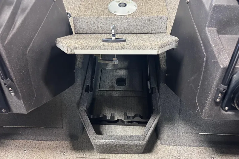 Slide: The Image of 2022 Tracker Targa V-18 WT boat interior storage compartment with open hatch. - 15
