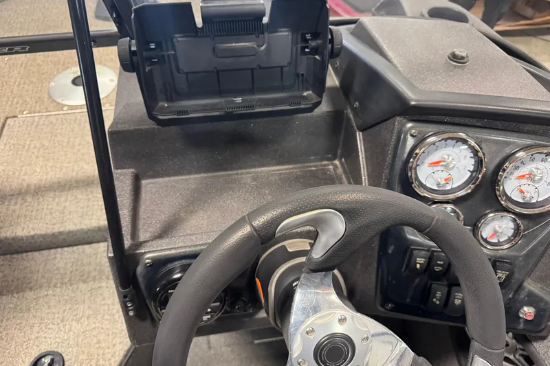 Slide: The Image of Dashboard of a 2022 Tracker Targa V-18 WT boat with steering wheel and gauges. - 8