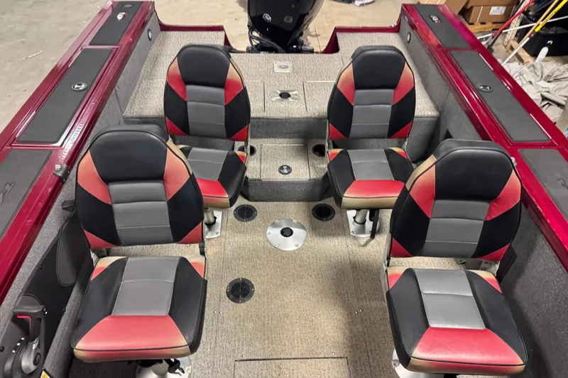 Slide: The Image of 2022 Tracker Targa V-18 WT boat interior with four cushioned seats, red and black design. - 9
