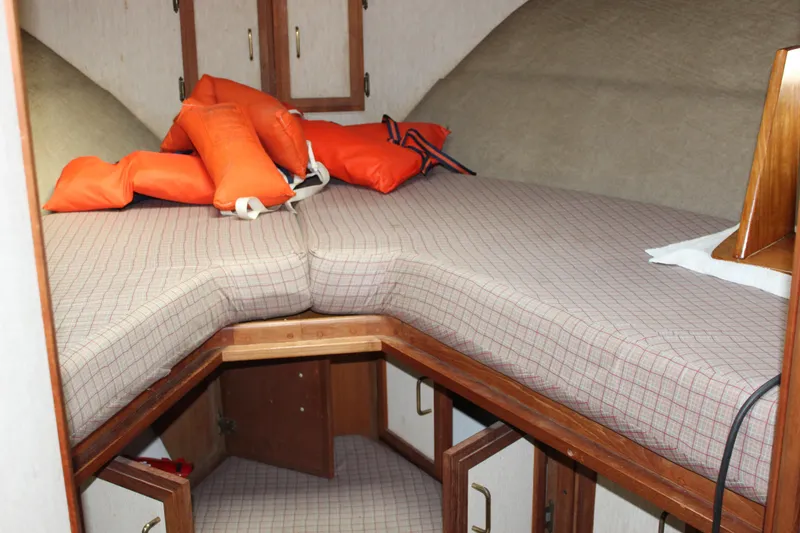 Slide: The Image of Interior cabin of 1985 Carver 32 Convertible with life jackets on bed. - 15