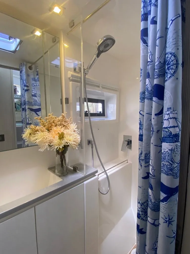 Slide: The Image of Leopard 40 yacht bathroom with shower and blue curtains, 2019 model. - 49
