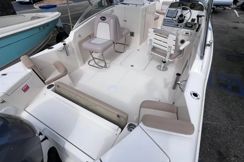 Slide: The Image of 2008 Scout 222 Dorado boat interior with seating and steering console. - 14