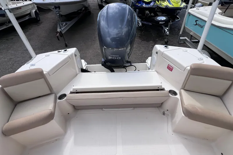 Slide: The Image of 2008 Scout 222 Dorado boat interior with Yamaha 200 engine, beige seating. - 15