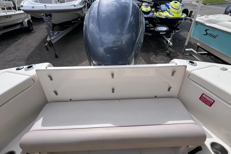 Slide: The Image of 2008 Scout 222 Dorado boat interior with seating and outboard motor view. - 17