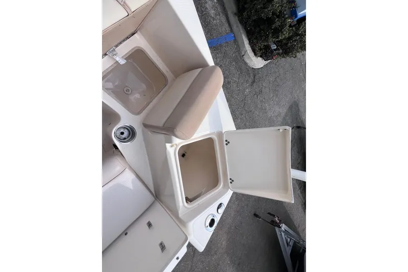 Slide: The Image of 2008 Scout 222 Dorado boat interior with open storage compartments and seating. - 18