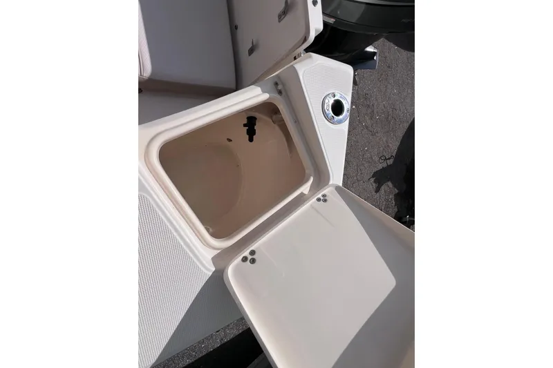 Slide: The Image of Open storage compartment on a 2008 Scout 222 Dorado boat. - 21