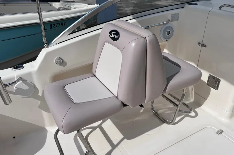Slide: The Image of 2008 Scout 222 Dorado boat interior with dual cushioned seats and stainless steel supports. - 22
