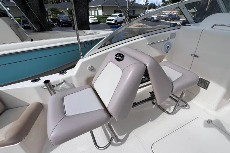 Slide: The Image of 2008 Scout 222 Dorado boat interior with dual seats and steering console. - 24