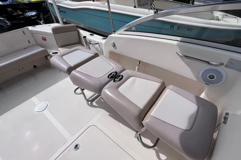 Slide: The Image of 2008 Scout 222 Dorado boat interior with cushioned seating and speaker. - 25