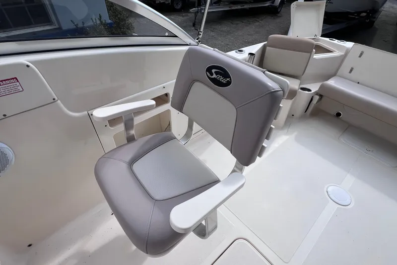 Slide: The Image of 2008 Scout 222 Dorado boat interior with cushioned seating and armrests. - 26
