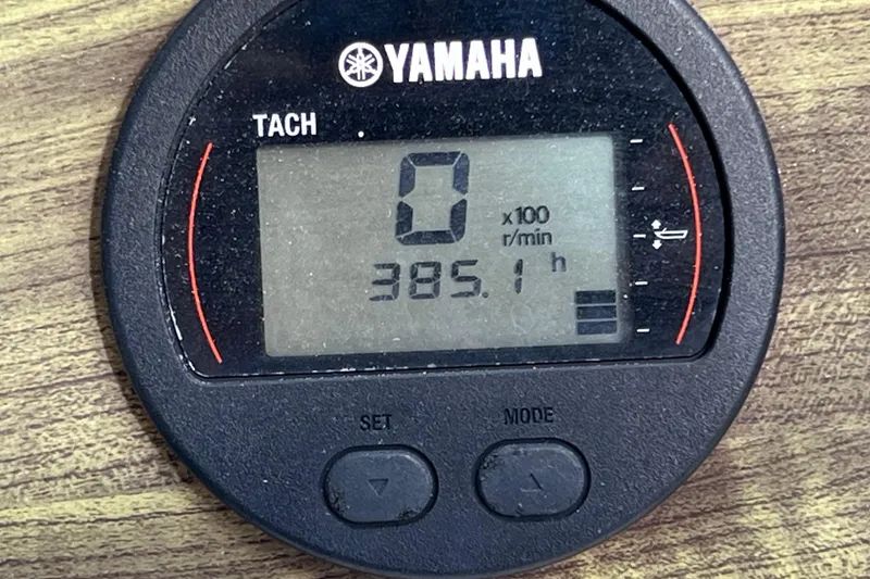 Slide: The Image of Yamaha tachometer displaying 385.1 hours on a 2008 Scout 222 Dorado boat. - 29