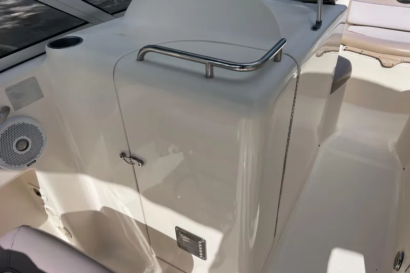 Slide: The Image of 2008 Scout 222 Dorado boat interior with seating and speaker system. - 32