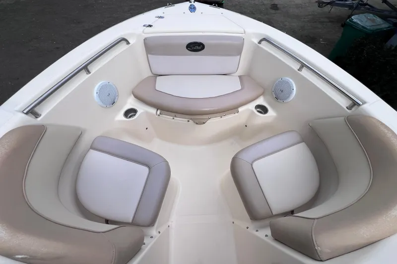 Slide: The Image of 2008 Scout 222 Dorado boat interior with cushioned seating and built-in speakers. - 34