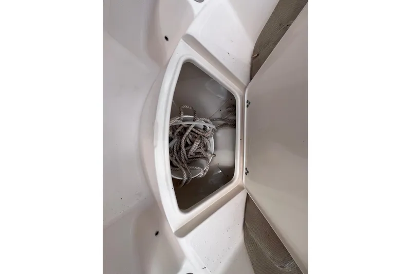 Slide: The Image of Storage compartment with rope inside a 2008 Scout 222 Dorado boat. - 35
